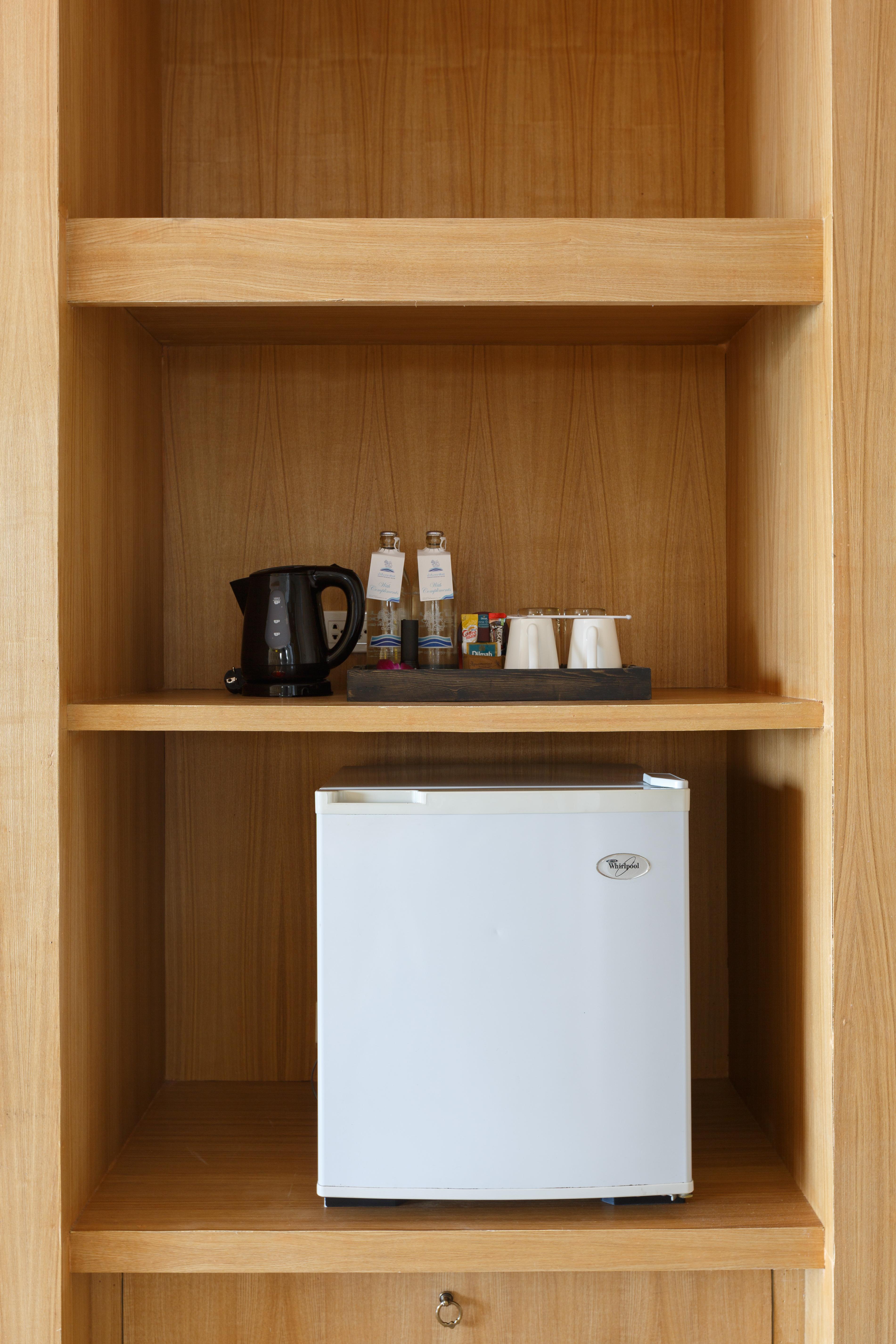 Namaka Resort Kamala Kültér fotó A small refrigerator in a hotel room